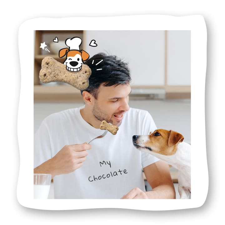 happy man giving dog treat to his dog