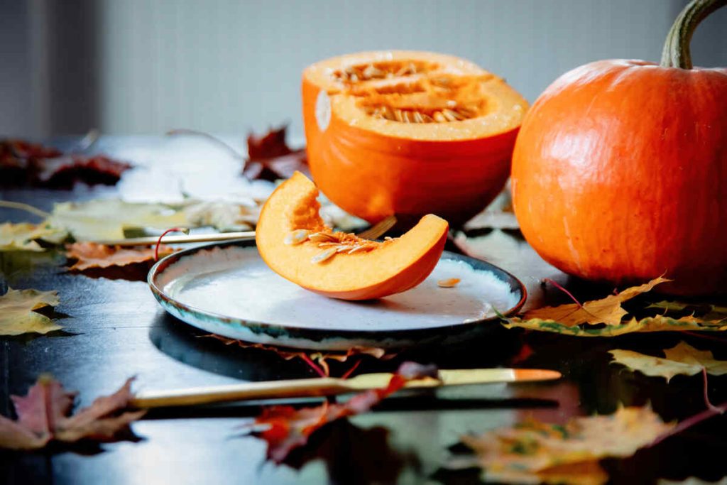 sliced pumpkin on a plate with cutlery on the table