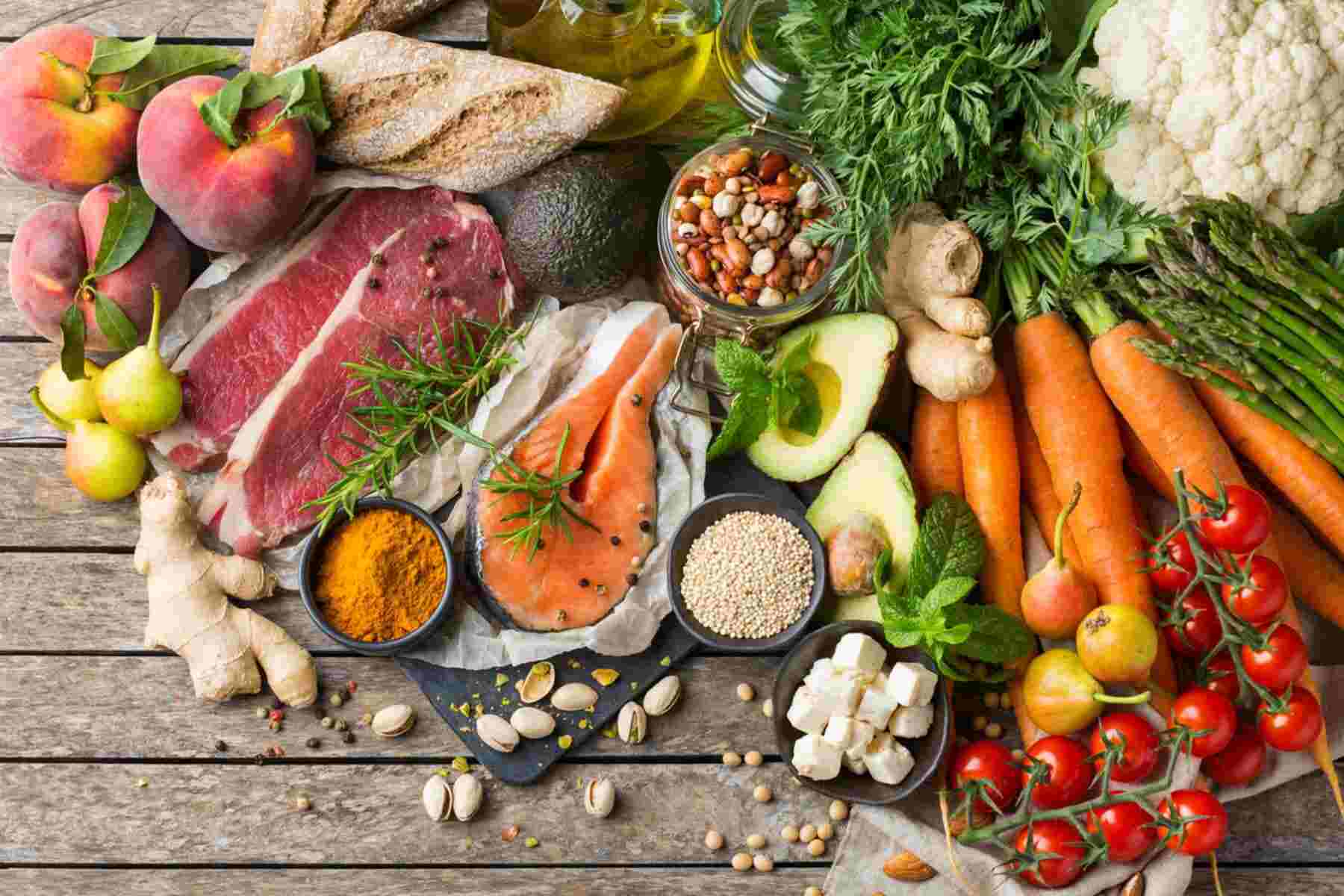 assortment of healthy food ingredients for cooking on a kitchen table