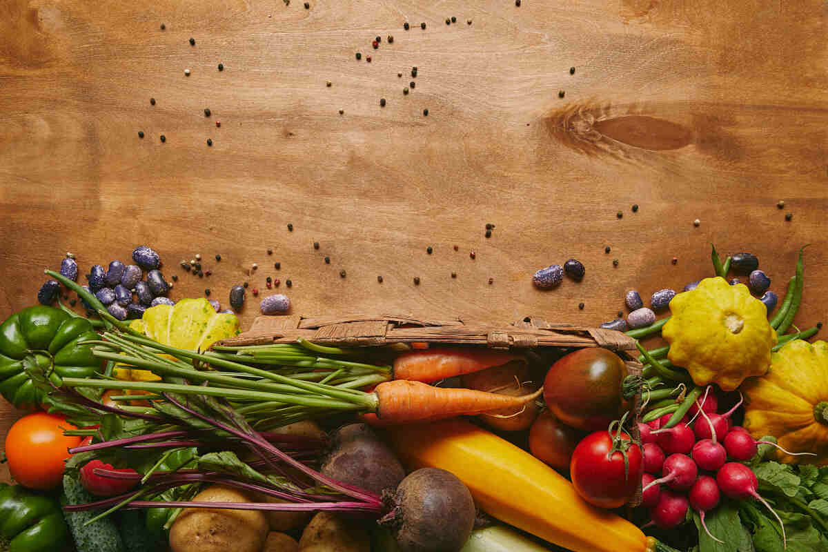 whole food template with fresh vegetables on wooden table